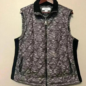 Workshop nylon puffer vest in plus size 1x. Zip front with stretch side panels